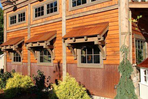 Eyebrow Roofs with Corrugated Rusty Metal on Bethel Office Building