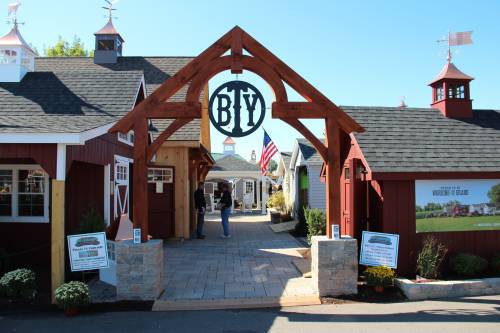 Timber framed entry with brand