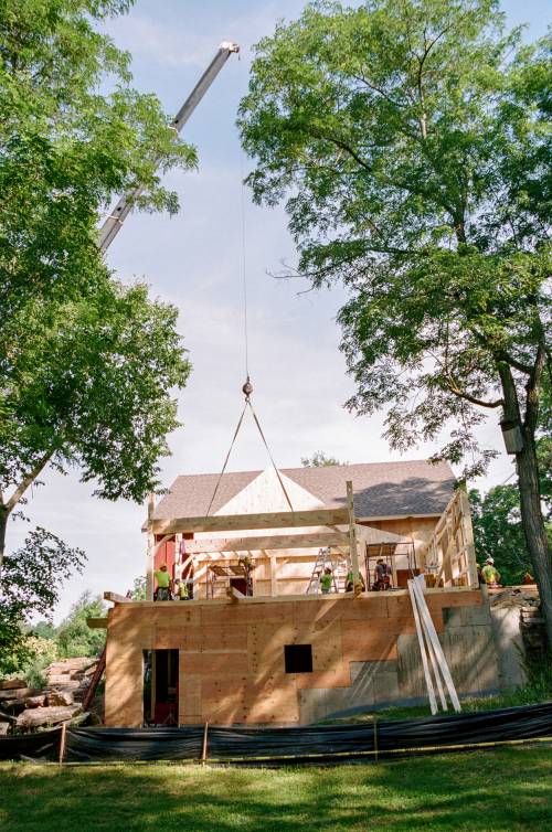 Crane lifts the second key beam