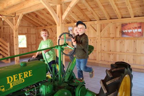 It takes 3 to drive this old tractor (and no remote control)