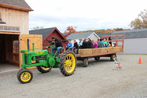 Pulled by a 1937 John Deere with Chris in the driver's seat