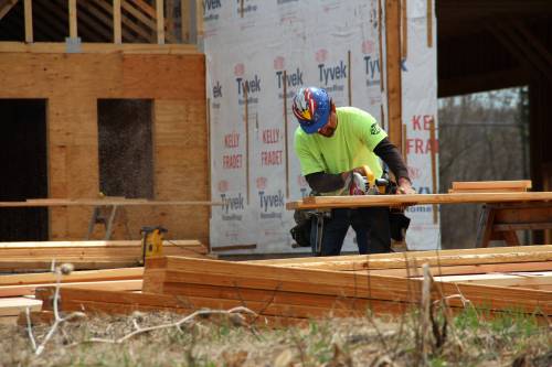 Norm cuts lumber for the dormer