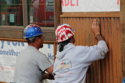 Norm and John Install Rusty Metal Siding