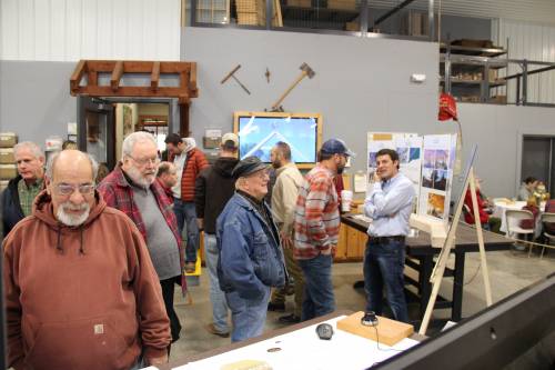 Visitors learning about the design process