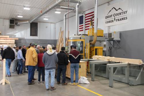 Engaged in learning the craft of timber framing