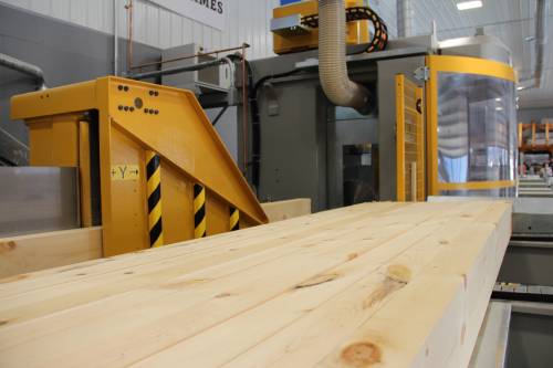 Timbers lined up to enter the machine