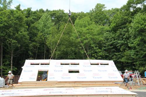 Raising the first wall panel of new office... a historic moment!