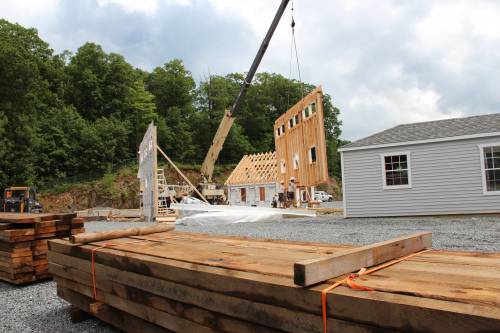 Office construction with barn board in foreground