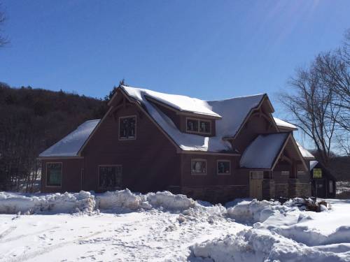 Lodge covered in snow