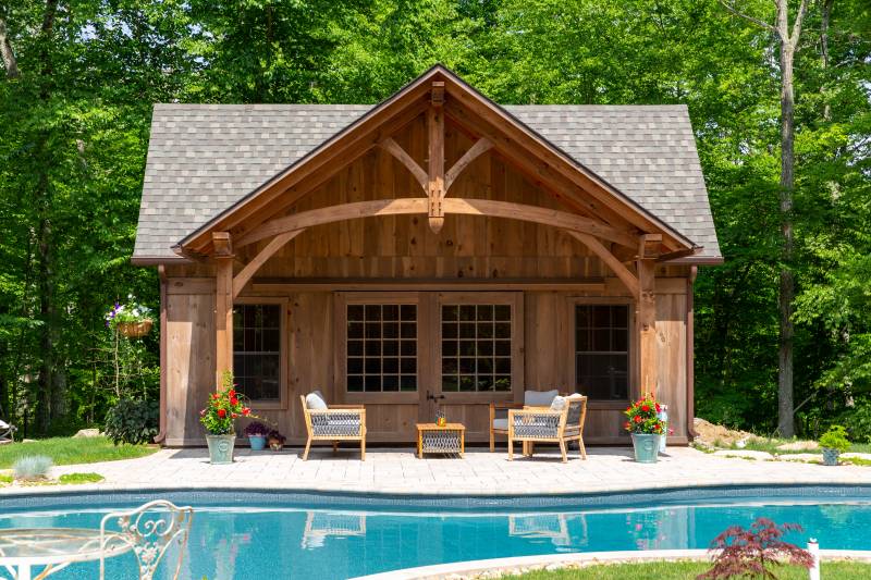 Timber Frame Front Overhang with Curved Bottom Chord