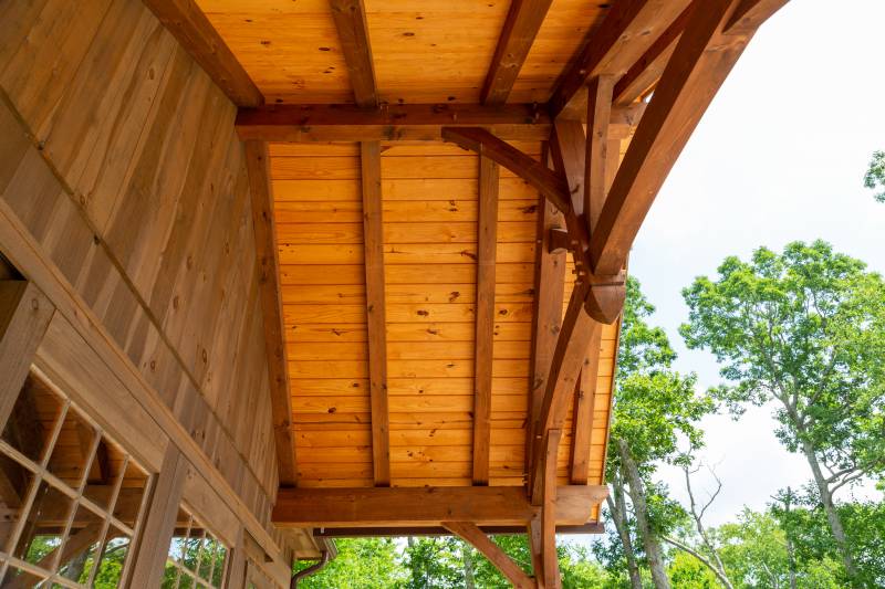 Pine Tongue & Groove Ceiling in the Timber Frame Overhang • Timber Details • Authentic Joinery