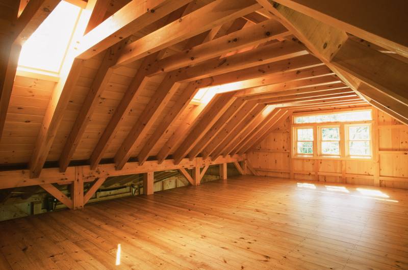 Skylights let in lots of natural light • Glass kneewall lets the joinery shine through