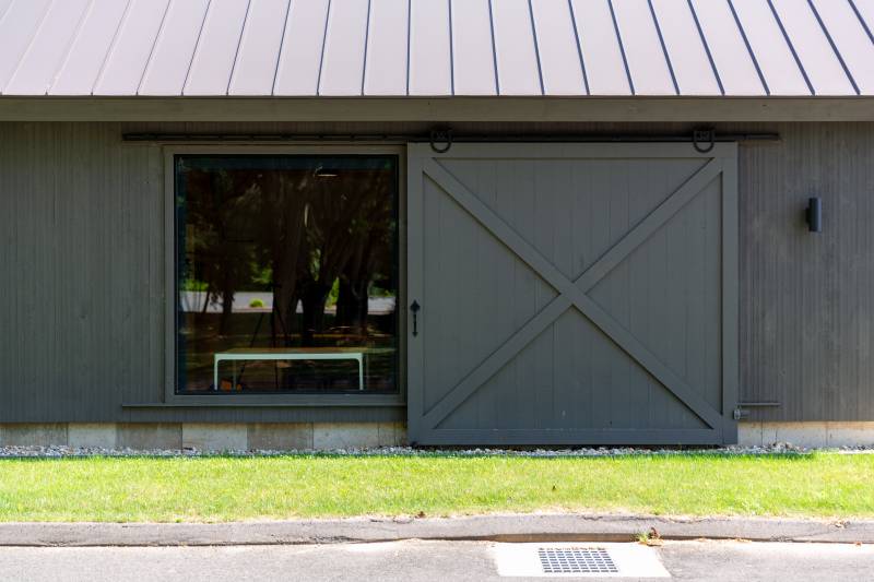 Sliding Barn Door Revealing Full Glass Window • Authentic Horseshoe Track