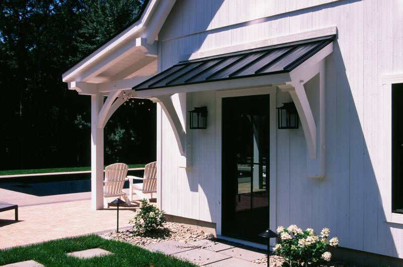 Timber Frame Eyebrow Roof over Andersen Entry Door