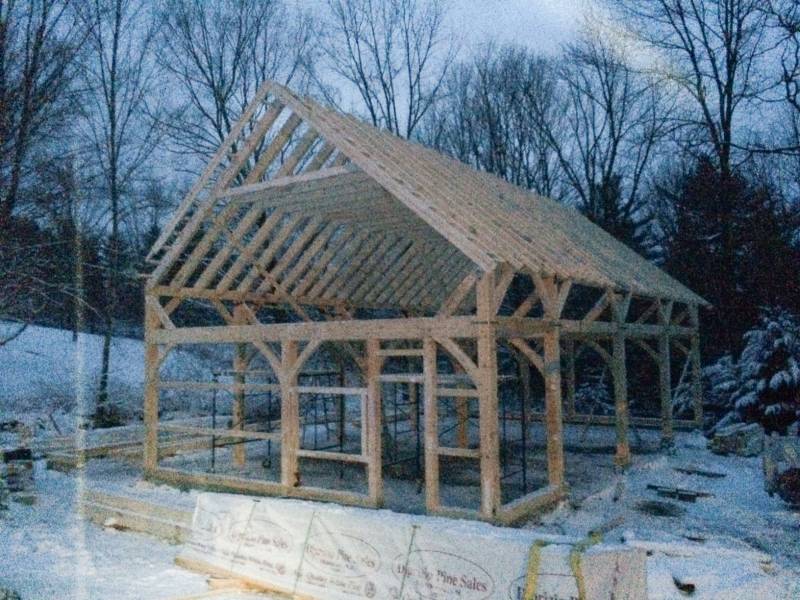 Snow falling on timbers