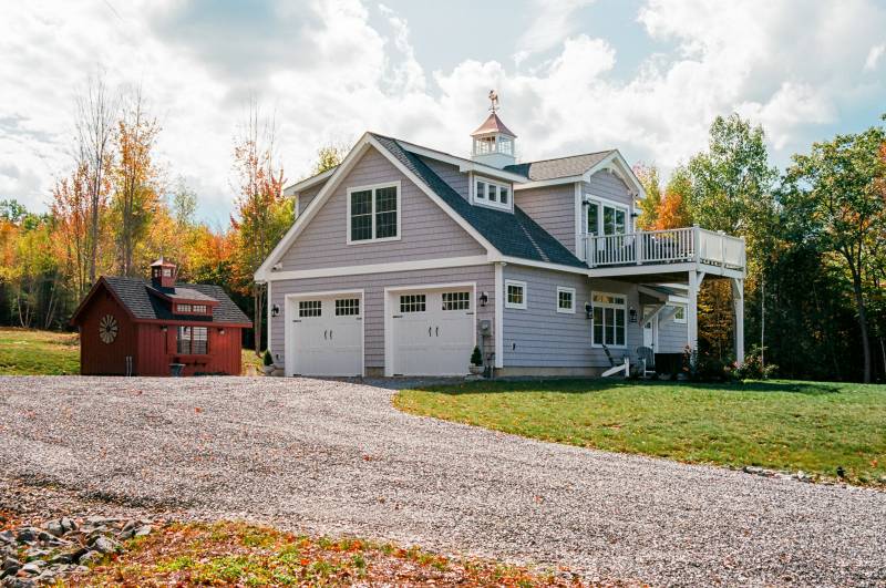 2-Car Garage Featuring Carriage-Style Steel Insulated Overhead Doors with Glass