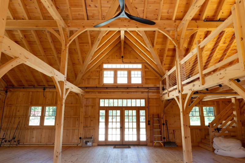 Looking towards the entrance with reverse gable dormer & full view glass doors