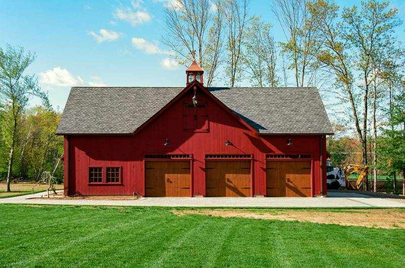 Barn garage front view showing reverse gable dormer & 3 garage doors