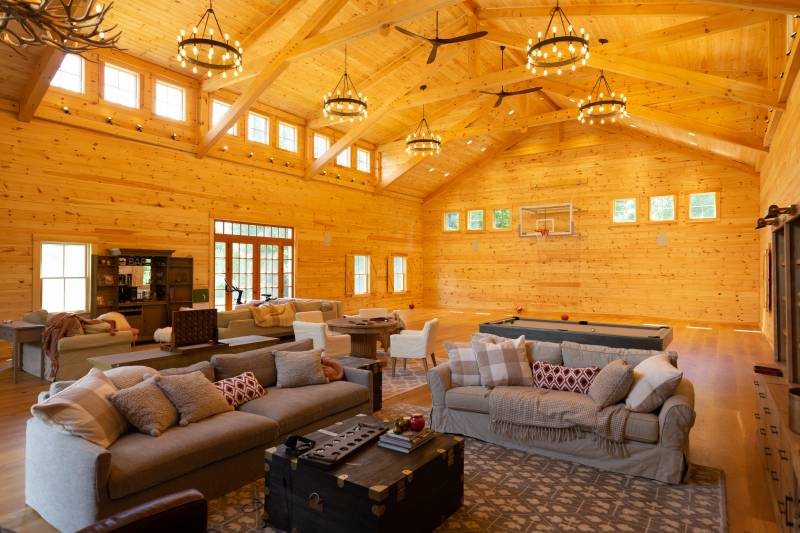 Inside the family barn with indoor basketball court • 36' transom dormer interior