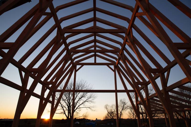 Inside the main section of the timber frame gambrel-style event barn