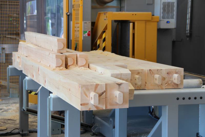 Timbers exiting the CNC machine