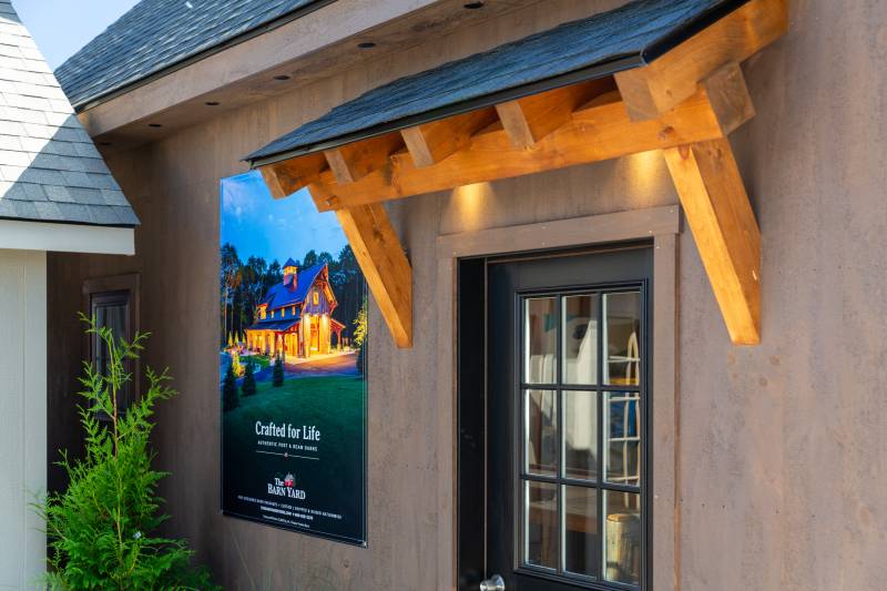 Timber Frame Eyebrow Roof over the entry door