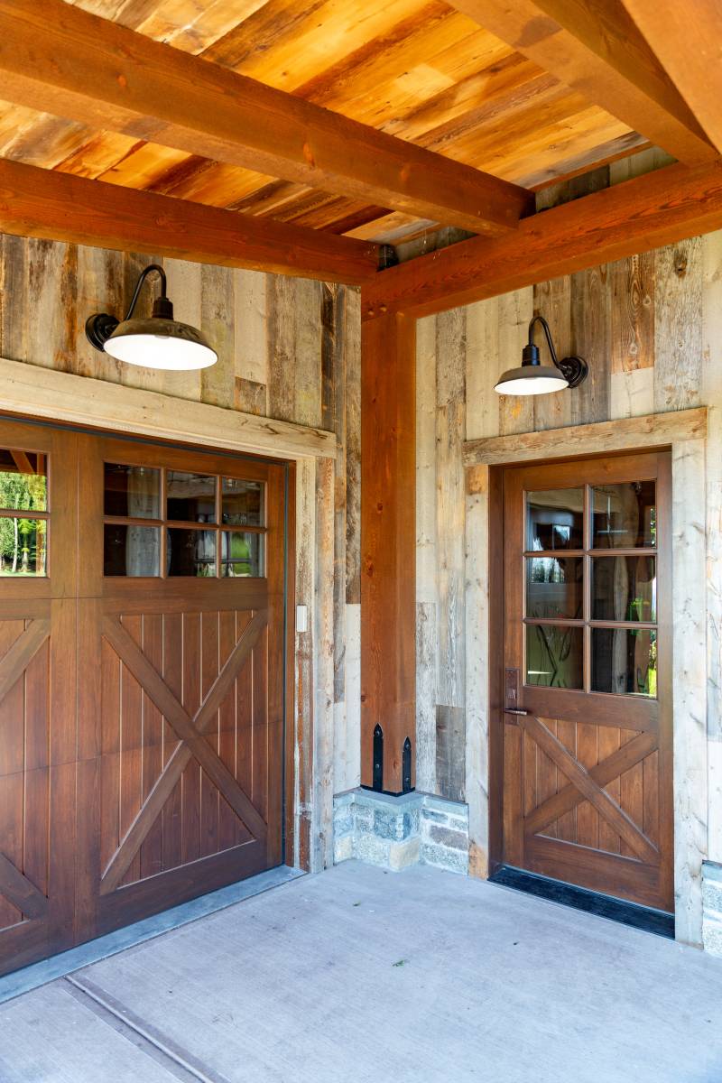 Reclaimed Barn Board Siding • Spanish Cedar Doors • Black Powder Coated Accents