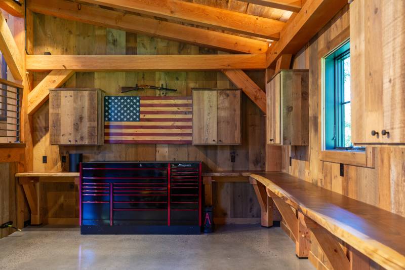 Inside one of the 14' x 50' Enclosed Lean-tos • Live Edge Timber Frame Workbench