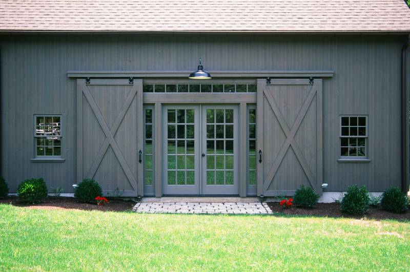 Double Barn Door Opens To Reveal French Doors • Timber Frame Barn
