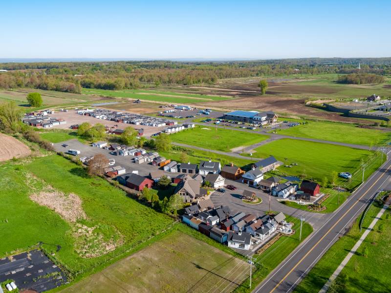 Our Showcase in Front, and Our In-Stock Inventory Lot in the Back • Ellington Town Center in the Top Right