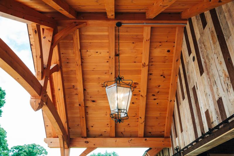 Looking Up at the Timber Frame Entryway • Authentic Post & Beam Construction