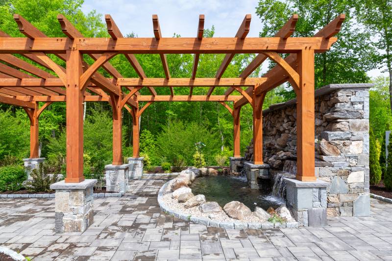 The Waterfalls Flow Into a Miniature Pond • Timber Frame Pergola
