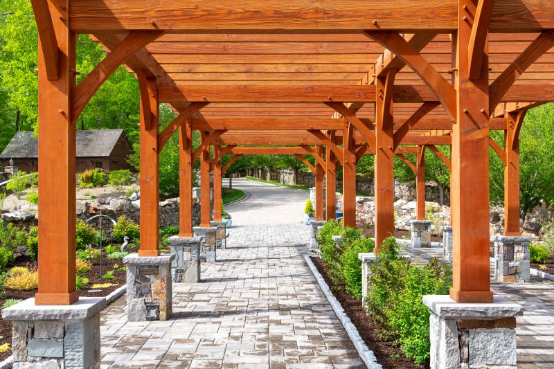 Arched Braces and Pergola Rafters Create Visual Interest