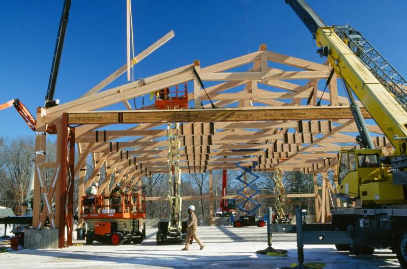 Cranes Carry the Rafters & Purlins to the Roof
