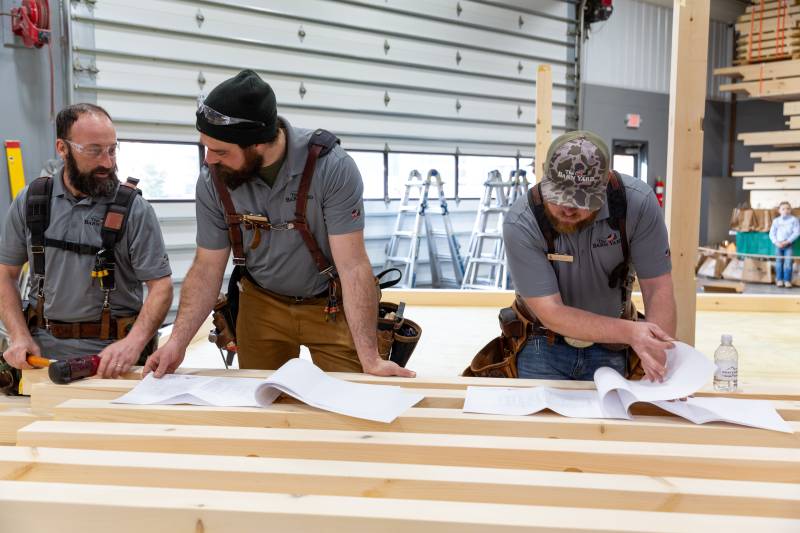 Lex, Matt, and Ben Looking Over the Gallatin Cabin Plans