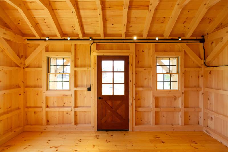 Trapper’s Cabin with Spanish Cedar entry door and Andersen 400 Series windows
