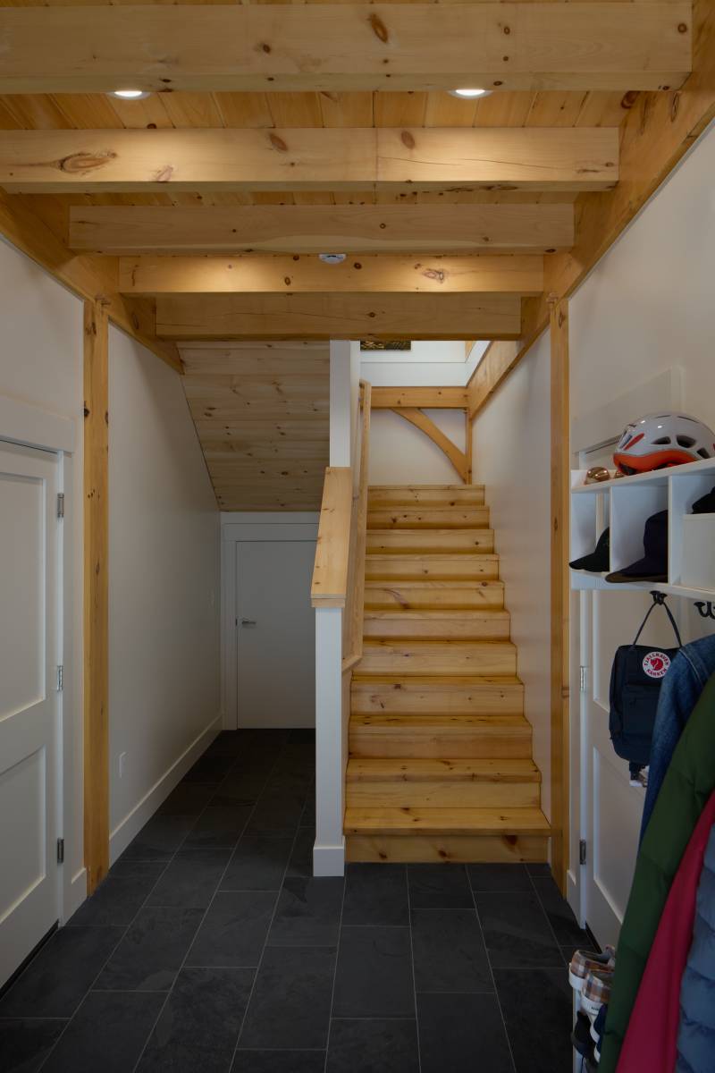 Stairs leading from the first floor garage to the second floor living space
