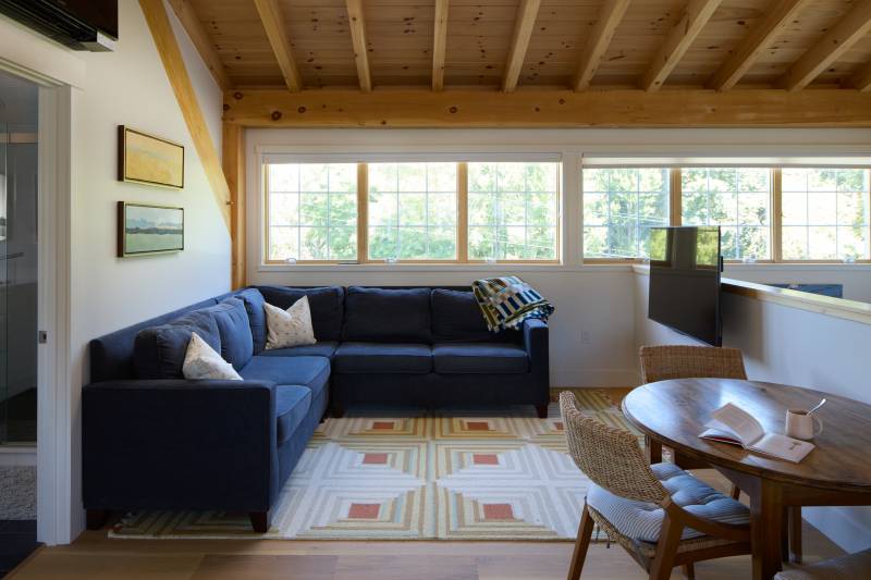 20' shed dormer with Andersen windows in the living room • country home upscale timber frame