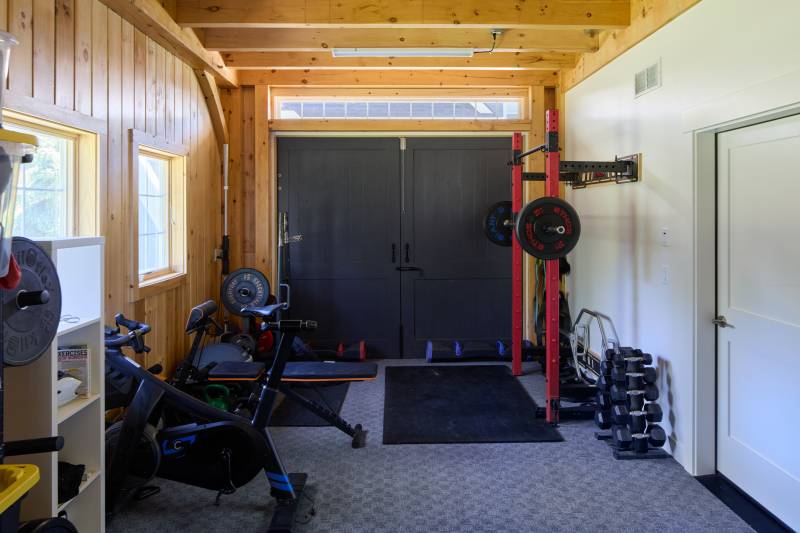 A workout room in the enclosed portion of the lean-to