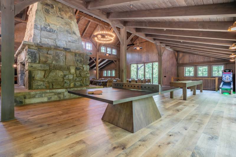 Table games in one of the enclosed post & beam lean-tos