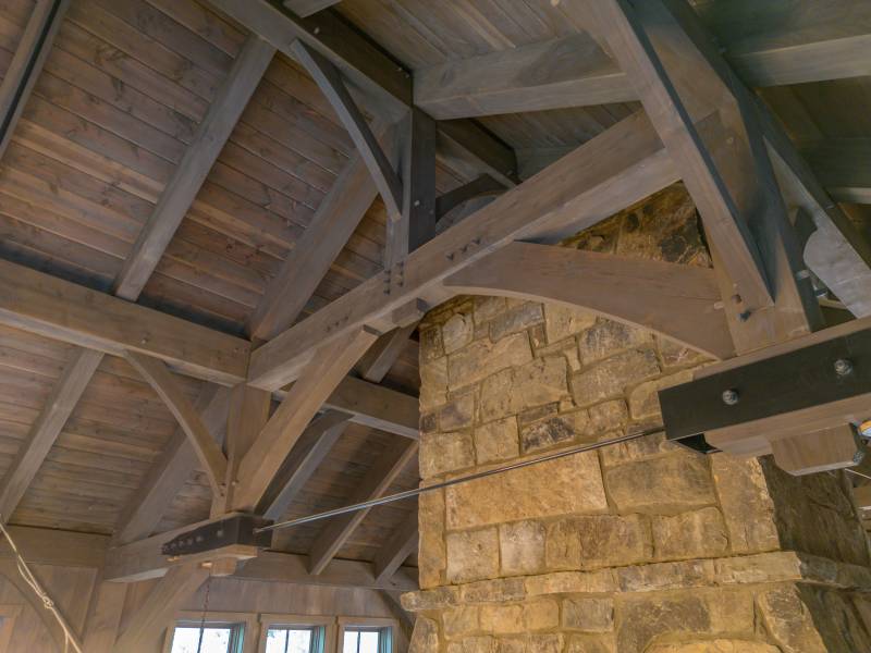 A closeup of the timber frame hammer beam trusses