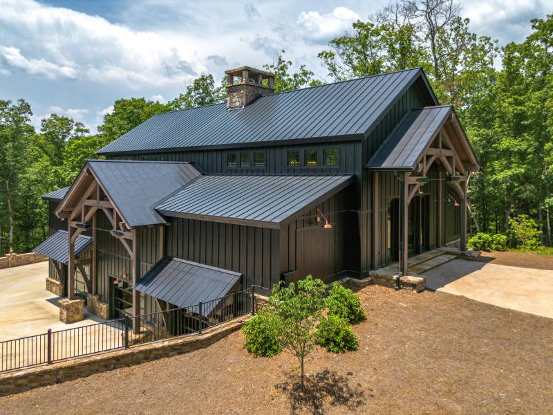 The timber frame entryways hint at the detailed post & beam interior