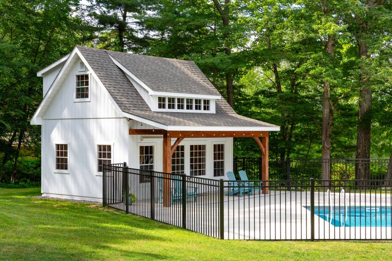 White windows, doors, and Duratemp siding • Backyard shed with overhang