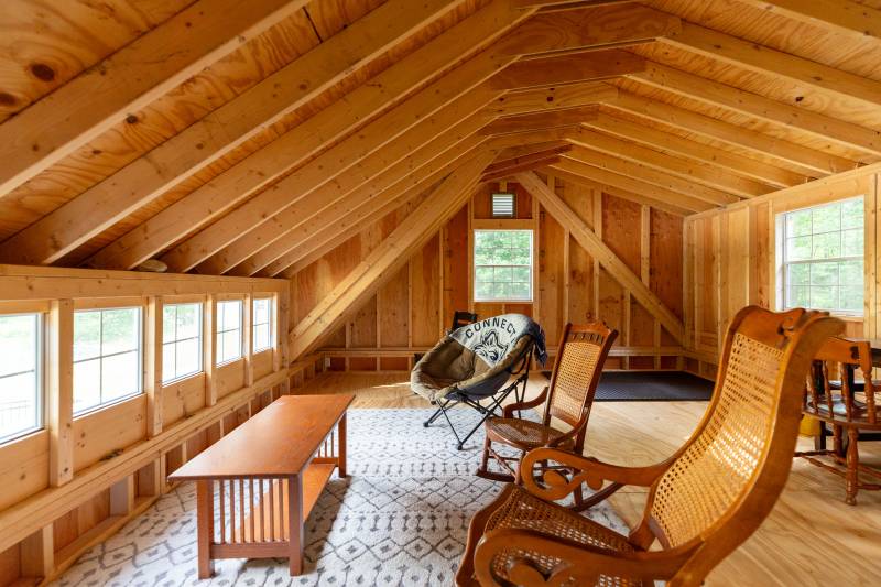Full loft inside the Grand Victorian Cape • Farmhouse Dormer & Shed Dormer