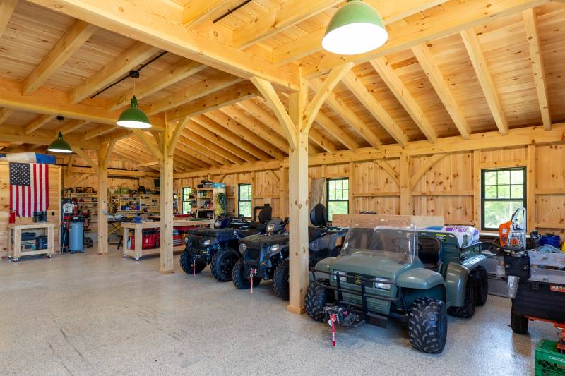 Looking towards the right lean-to • post & beam barn timber frame barn design