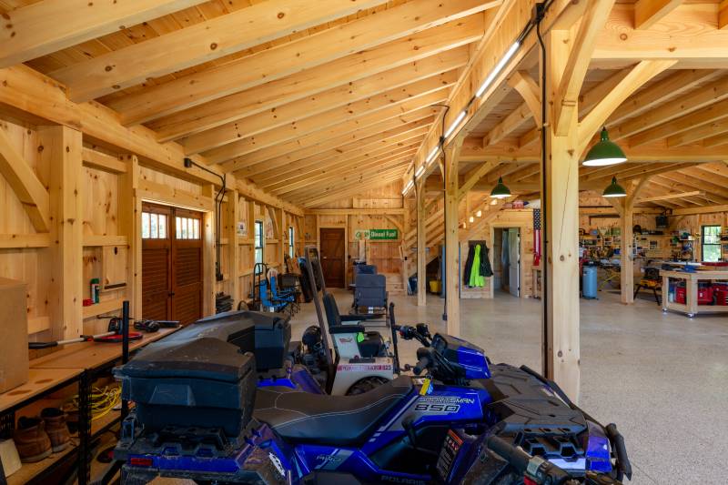 Seating area in the back • Pine doors lead outside • timber frame monitor barn