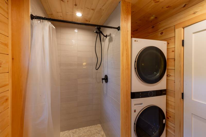 The bathroom under the stairs has space for a shower and laundry