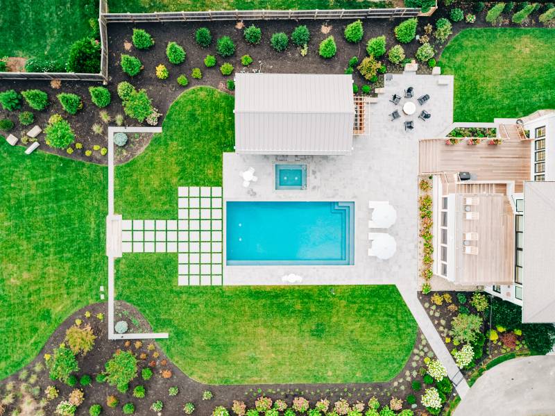 Aerial view of the backyard poolscape • post & beam timber frame pool house