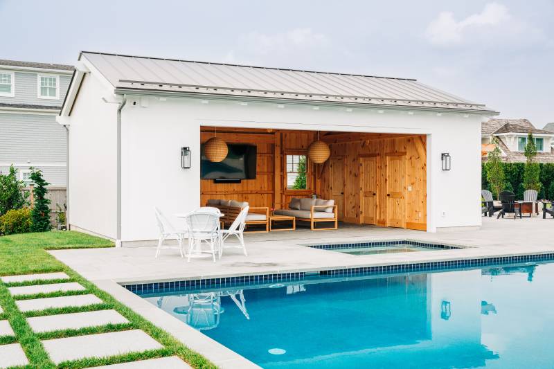 White Siding • Metal Roof • Post & Beam Pool House