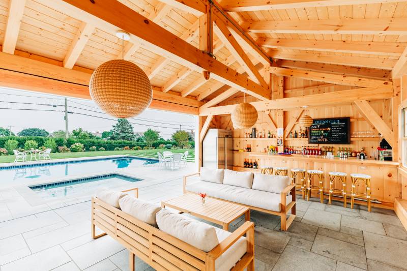 Seating area and stocked bar • Authentic post & beam construction throughout